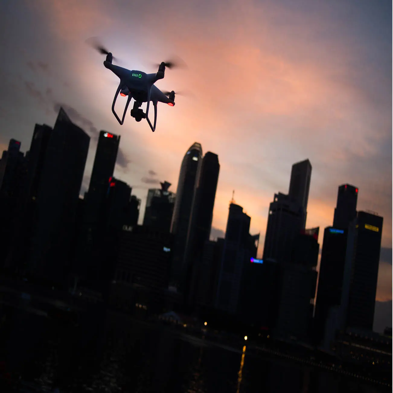 drone flying over city buildings
