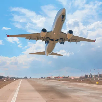 plane soaring over runway