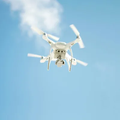 drone flying overhead with blue skies in background