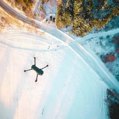 drone flying over snowy scene