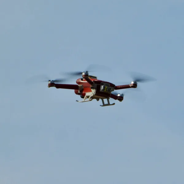 law enforcement drone flying overhead in sky