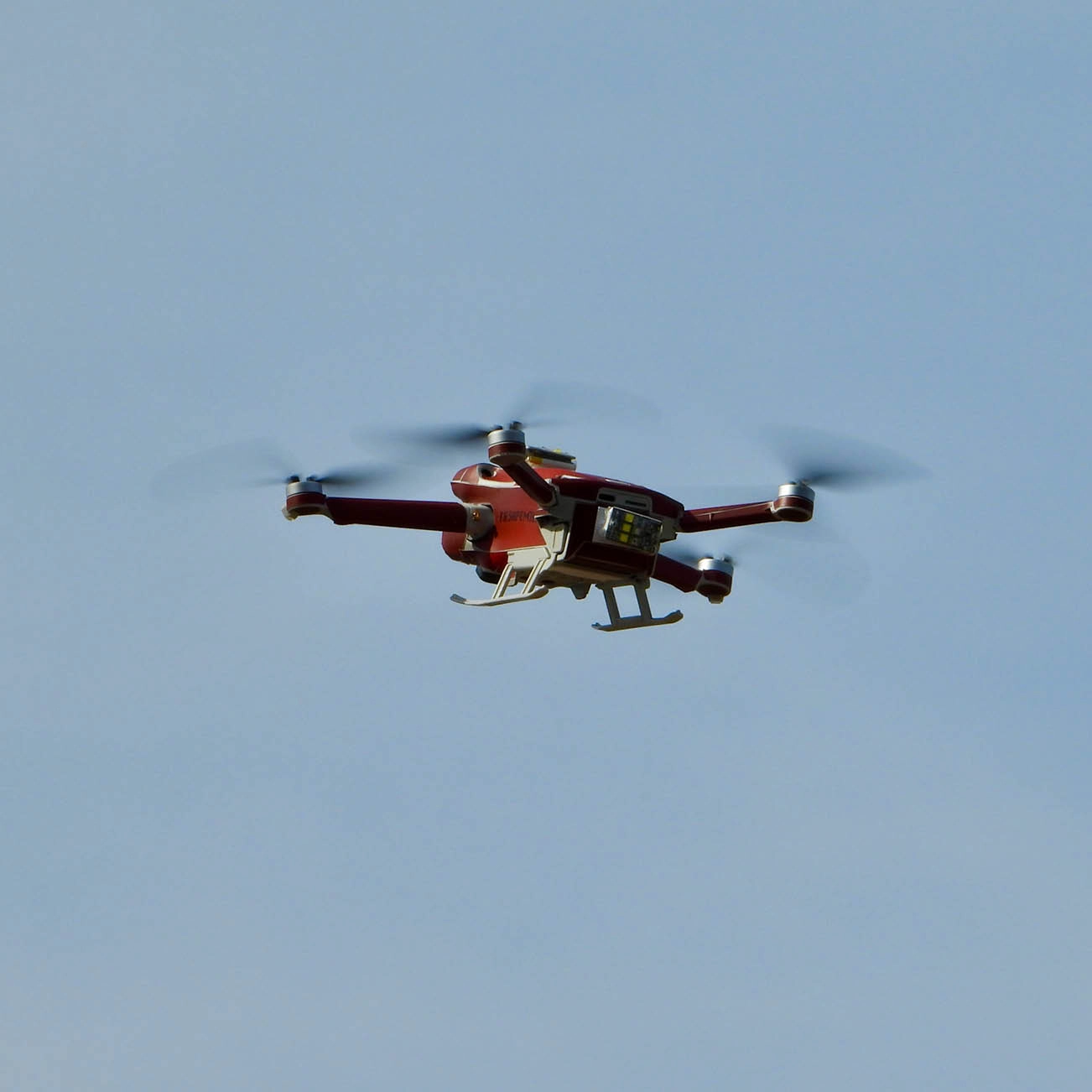 law enforcement drone flying overhead in sky