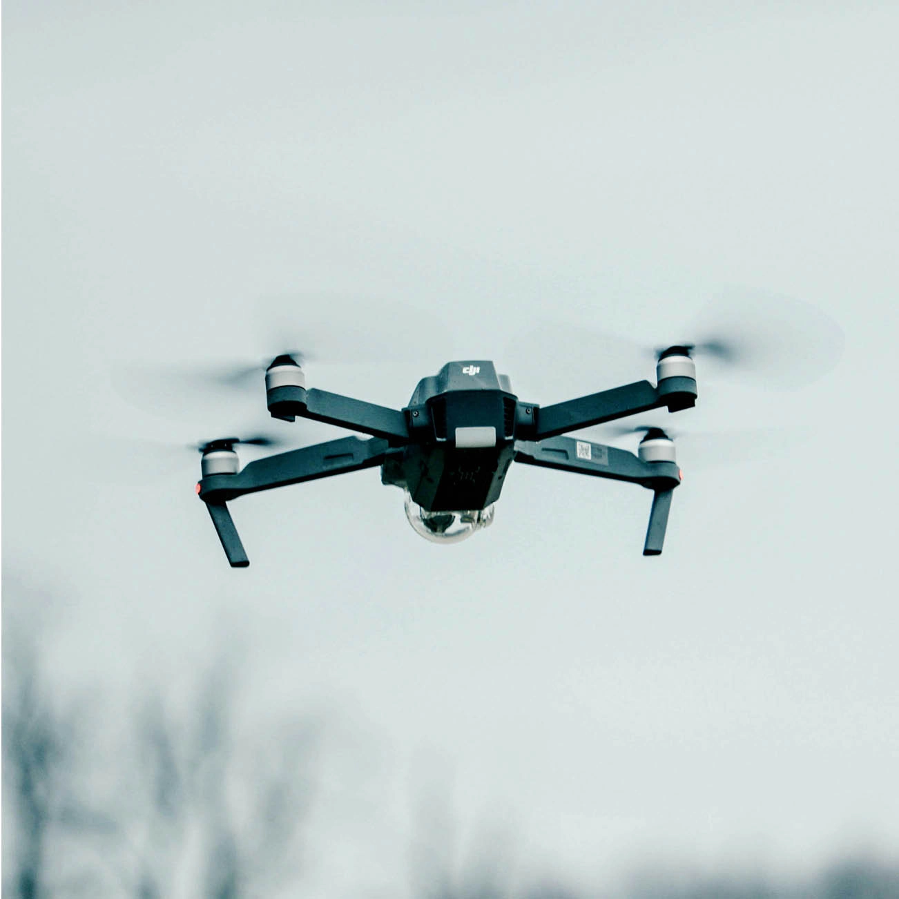 black drone hovering in the air