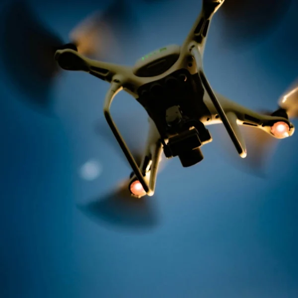 Underview of drone lifting off into flight